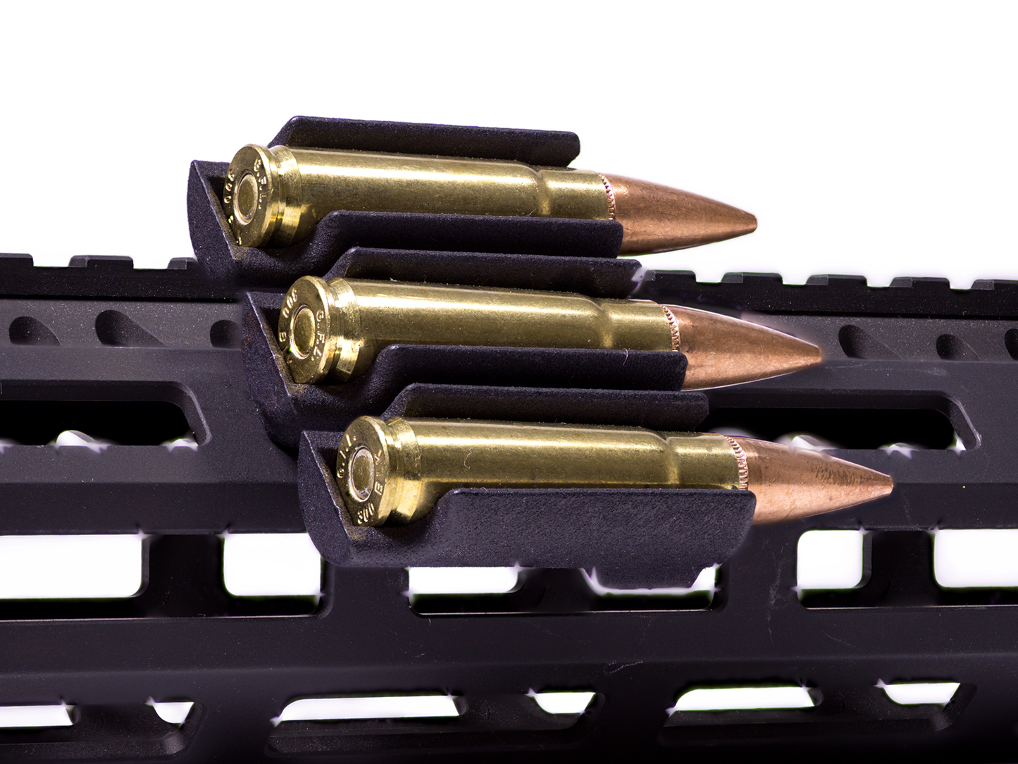 Ammo Carrier for M-LOK rail holding three .223 rounds on a rifle