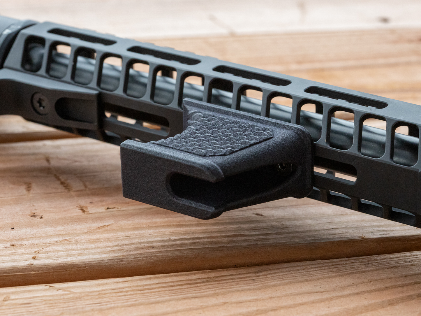 Hand stop installed on a modern sporting rifle